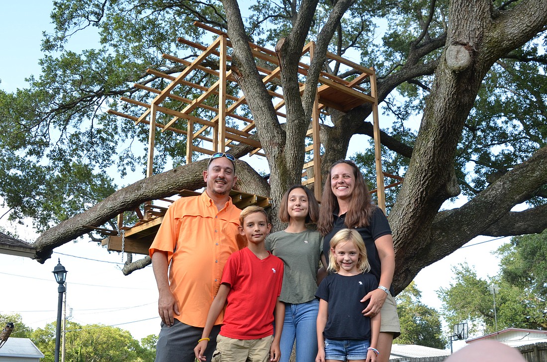 Ellie, 5; Cecil, 9; and Abby, 12, are eager to see their treehouse finished. Their parents, Tony and Sara Farese, have had to halt construction until Planning & Zoning can review the project in July.