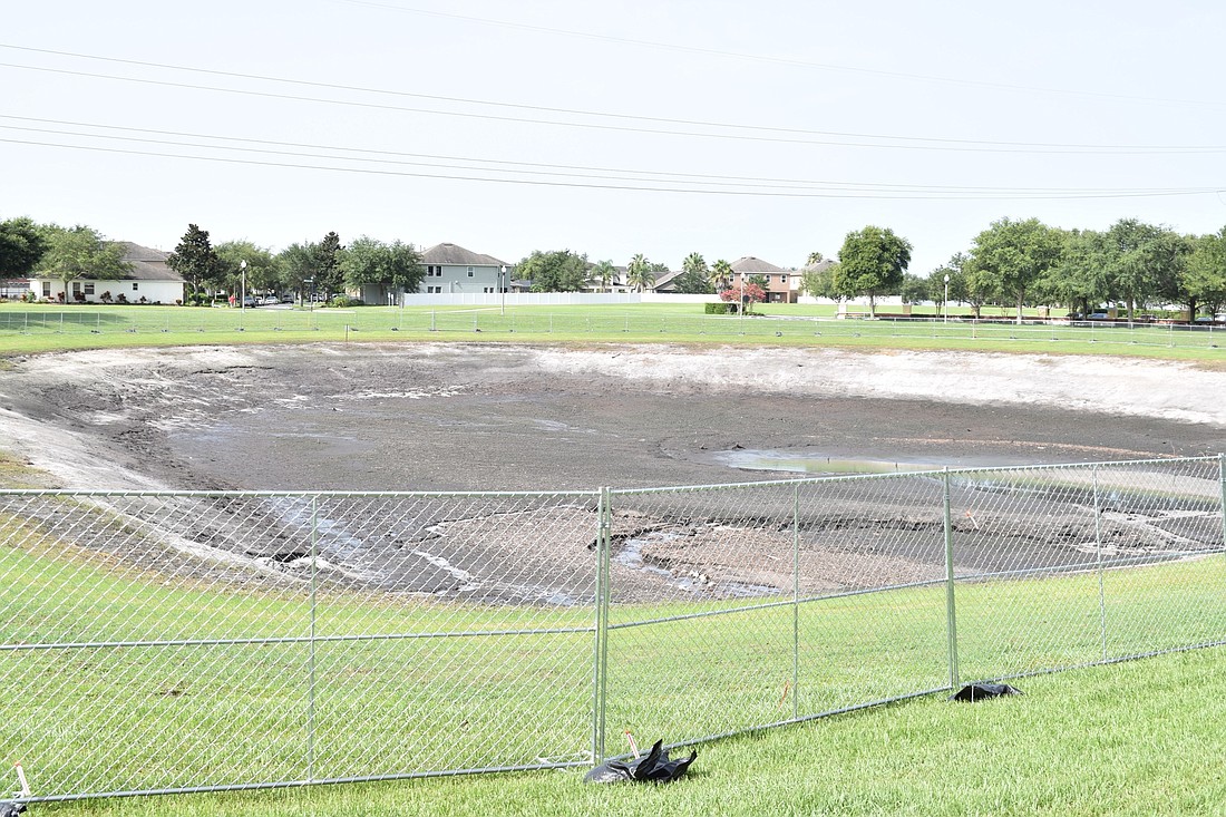 Water loss in the pond on Avenue of the Groves in Horizon Westâ€™s Independence community is being investigated by county officials.