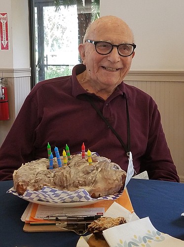 Ted Van Deventer enjoyed a giant apple fritter on a recent birthday.
