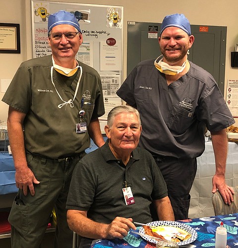 Three generations of the Cox family have practiced with West Orange Orthopaedics: William Cox, seated; Kevin Cox, left, and Jacob Cox.