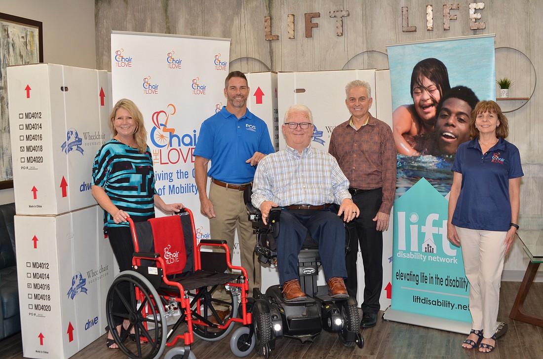 Three nonprofit organizations came together for West Orange County residents temporarily in need of a wheelchair: Jennifer Talbot, left, Eric Roukey, Jim Hukill, Glen Mather and Barbara Welch.