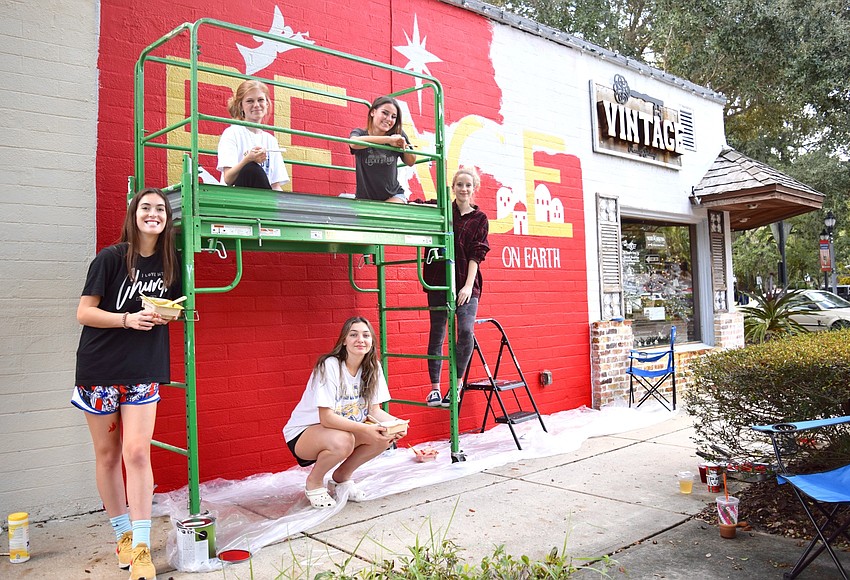 Foundation Academy students paint Windermere holiday mural West