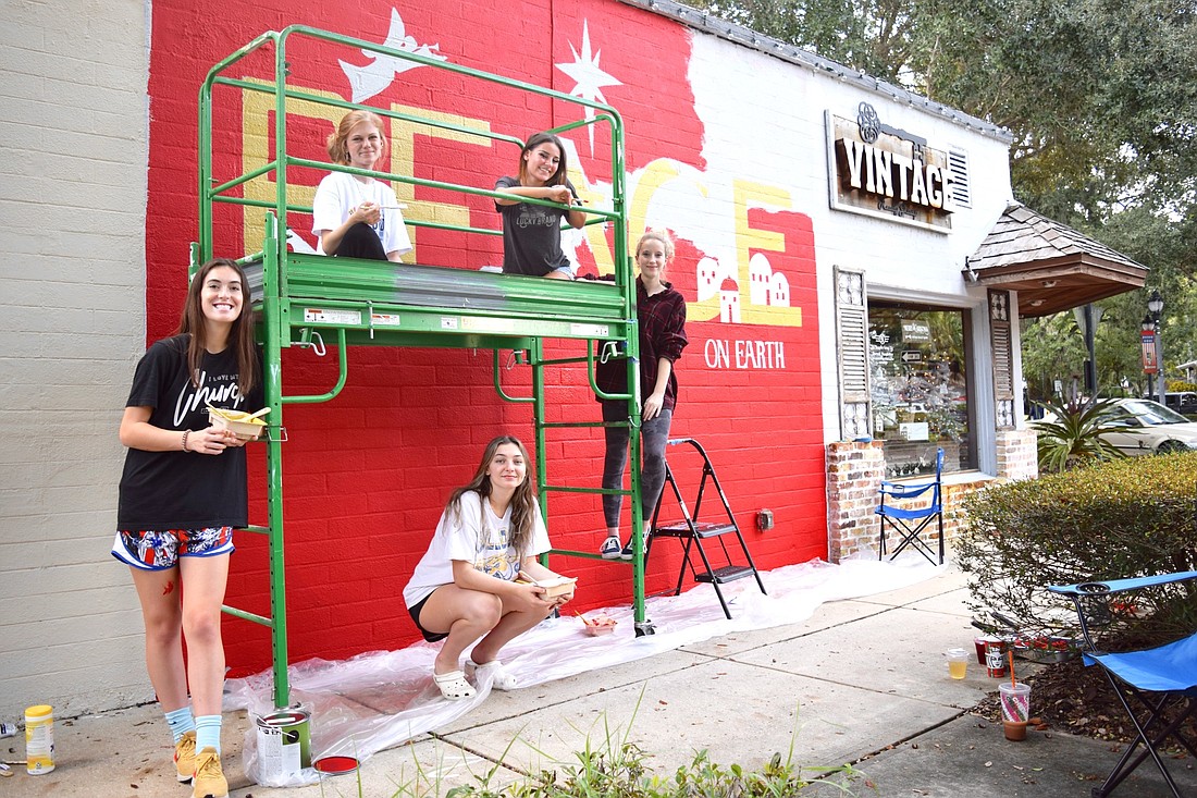 These five Foundation Academy students were honored to bring Vintage Realty Groupâ€™s holiday mural to life. From left: Dallas Armstrong, Ella Kline, Landry Wolverton, Isabella Gennaro and Sarah Ford.