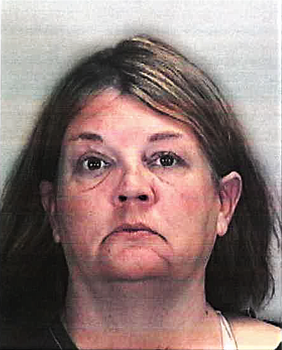 Bradenton&#39;s Michelle Haney, 48, has been charged with abuse of a dead human body after the body of Jon Christopher Leonard, 40, was found in a trash can in East County. Leonard had been dead since July.