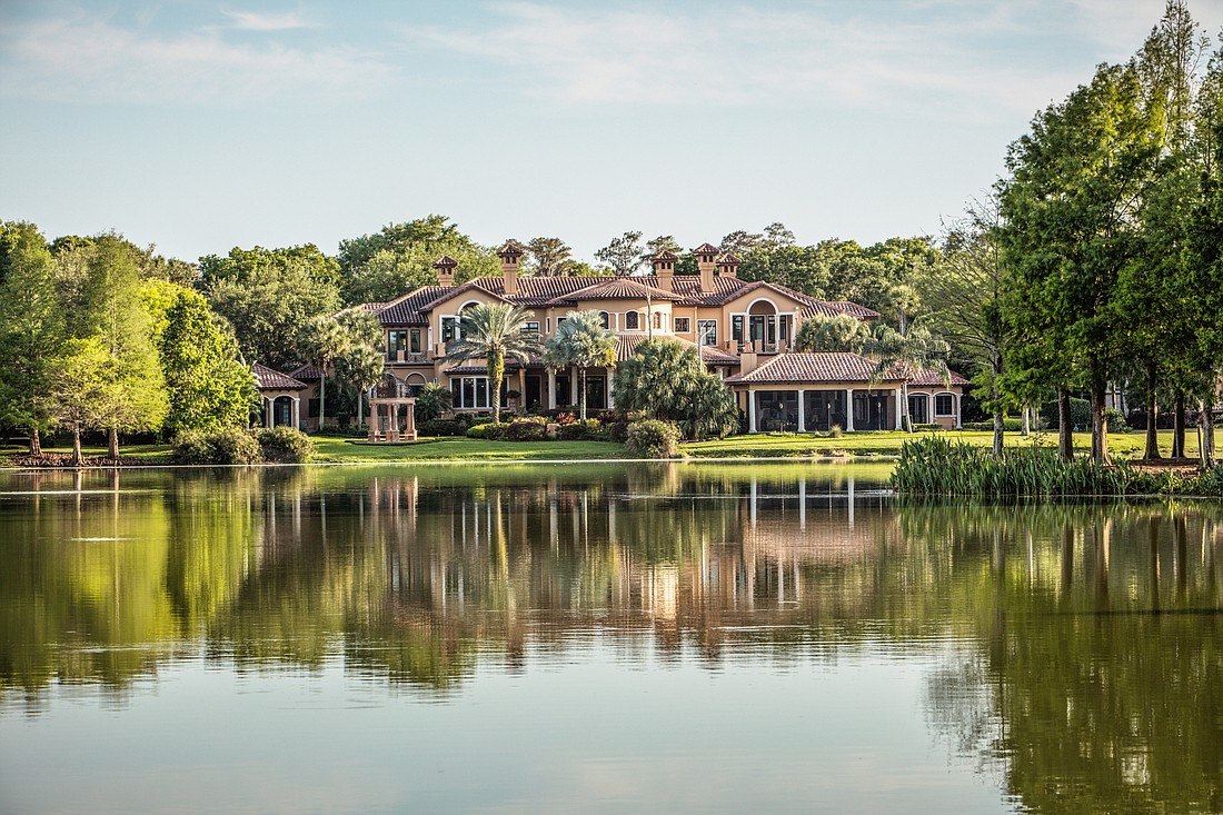 This Isleworth estate, at 5372 Isleworth Country Club Drive, Windermere, will be auctioned off by Jan. 26. (Courtesy Concierge Auctions)