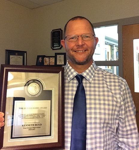 Kenneth Boyd received a plaque for his role as WOHS director of bands and orchestras.