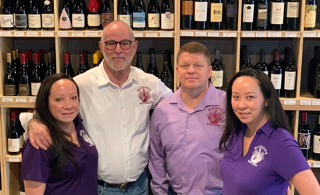 Lisa and Blaine Nelson and Jason and Susan Maynard are the owners of Maysonâ€™s Wine Shop in Ocoeeâ€™s Westyn Plaza. This is one of 10 businesses celebrating the grand opening on Saturday.