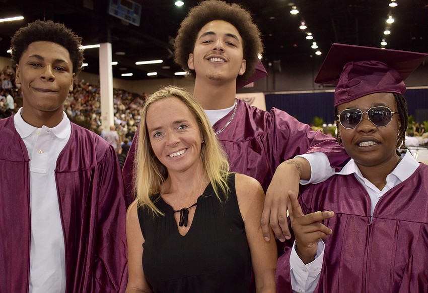Teacher Cyndi Weitzel joins Sheldon Young Jr., Thomas McNear and Devonte Henry.
