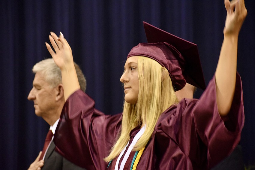 Elizabeth Bain performs a sign language translation of The Star Spangled Banner.