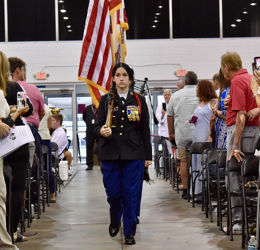 The ROTC Color Guard is joined by the Kiltie Pipers in presenting the American and Florida flag.