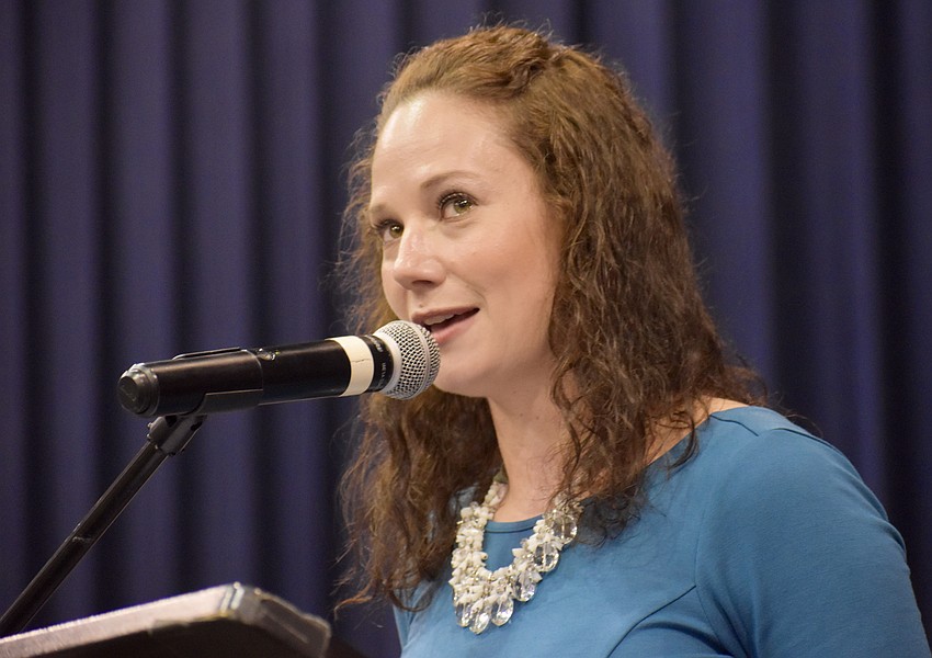 Riverview High principal Erin del Castillo welcomes friends, family, faculty, staff and students to Robarts Arena.