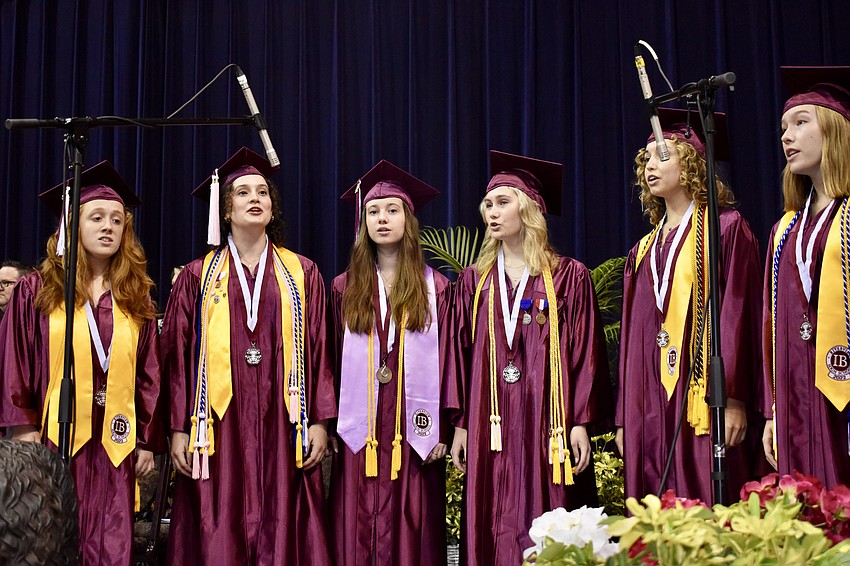 Senior members of the Riverview High choir sing The Star Spangled Banner.