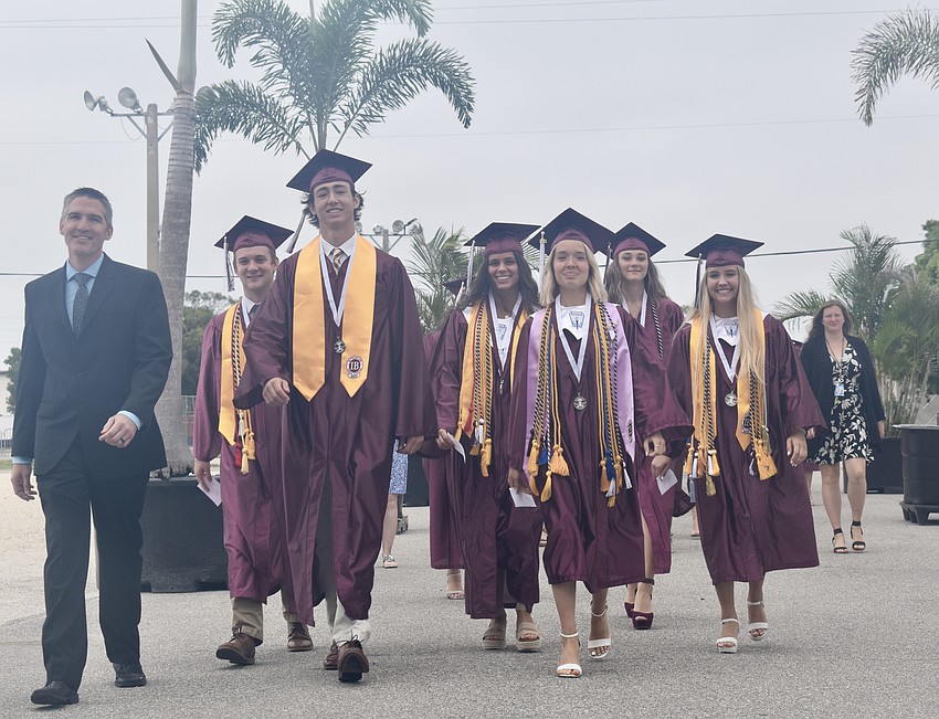 The first group of seniors walk into Robarts Arena.