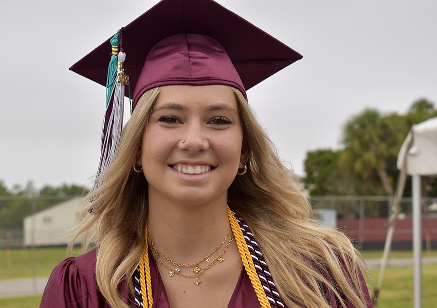 McKenna Flaherty joins her class in preparing for the ceremony.
