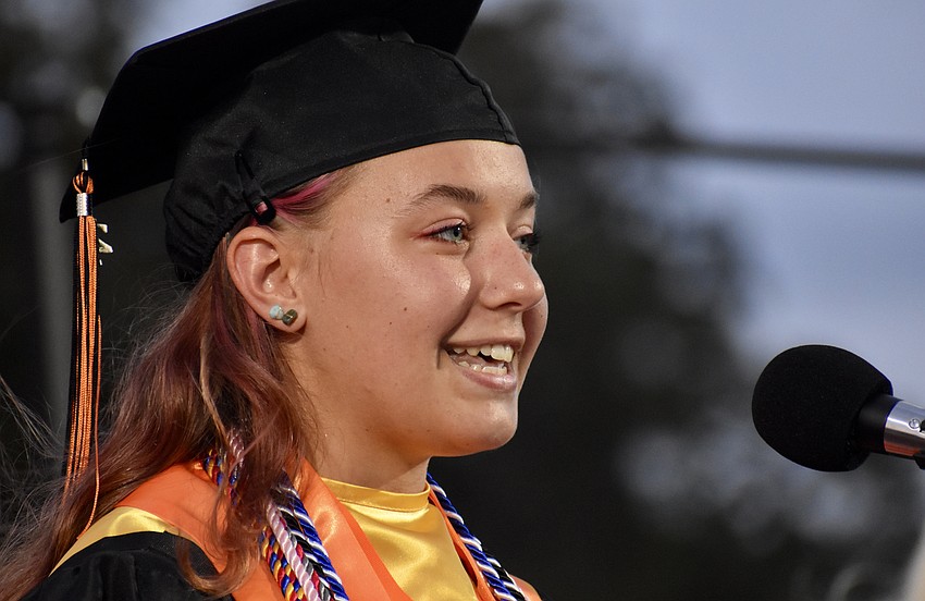 Anna Lazzaro makes her senior address, with a smile.