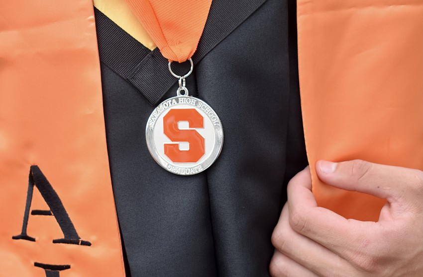 Each graduate wore a Sarasota High medallion.