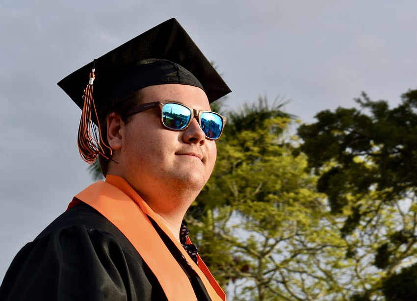 Ethan Adams sports some cool shades as he walks into a sunny Cleland Stadium.