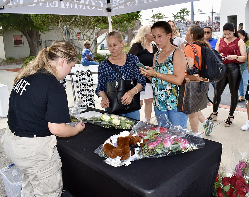Graduation gifts were on sale just outside the stadium gates.