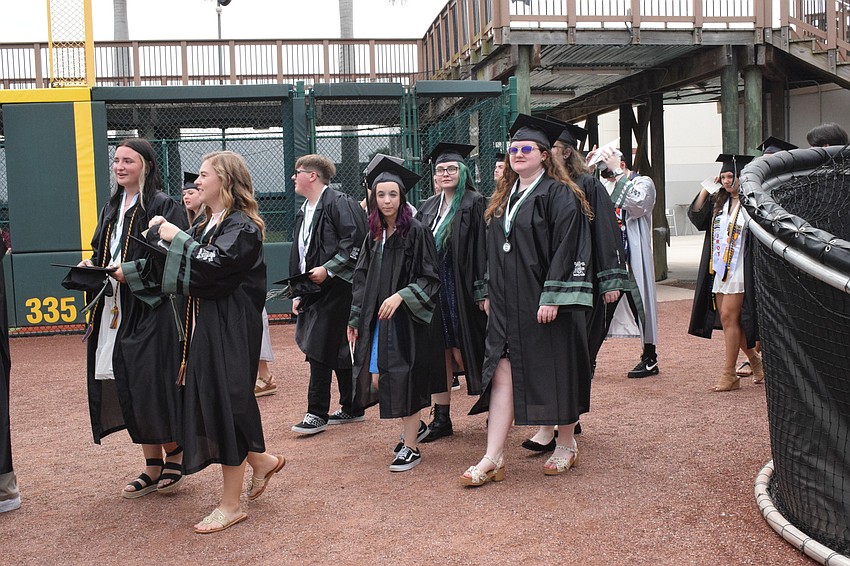 Graduates make their way into LECOM Park.