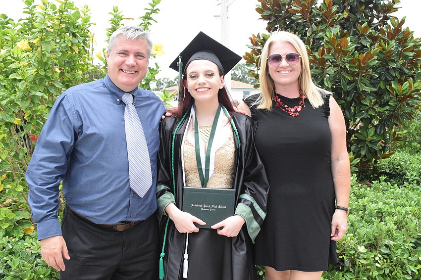 Eamonn Barr, Kimberley Barr and Elly Barr celebrate Kimberley Barry's graduation. 
