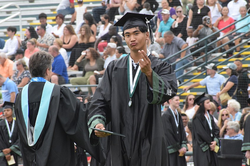Neale Ngov enjoys his graduation moment.