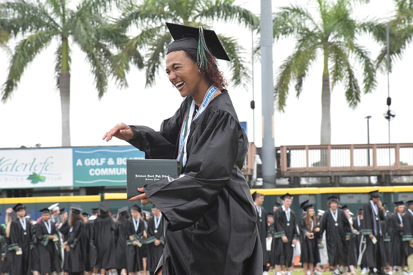 Sydney McCray celebrates receiving her diploma.