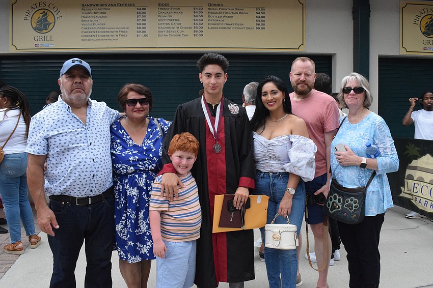 Graduate Thomas Urrutia-Bravo (center) celebrates with his grandparents Norberto and Juana Ramirez, his brother, Mason Struble, his parents, Karina and Brian Struble, and his grandmother Karen Struble.