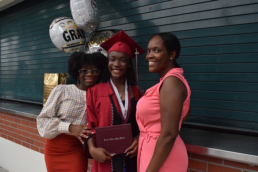 Sandy Dor, Laury Charles and Nadege Gean have fun celebrating Charles' graduation.