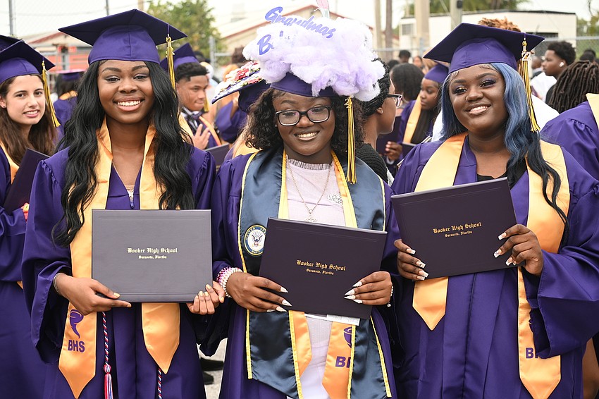 Graduates Jakayla White, Jada Woods and Gaelle Joseph moments after graduation