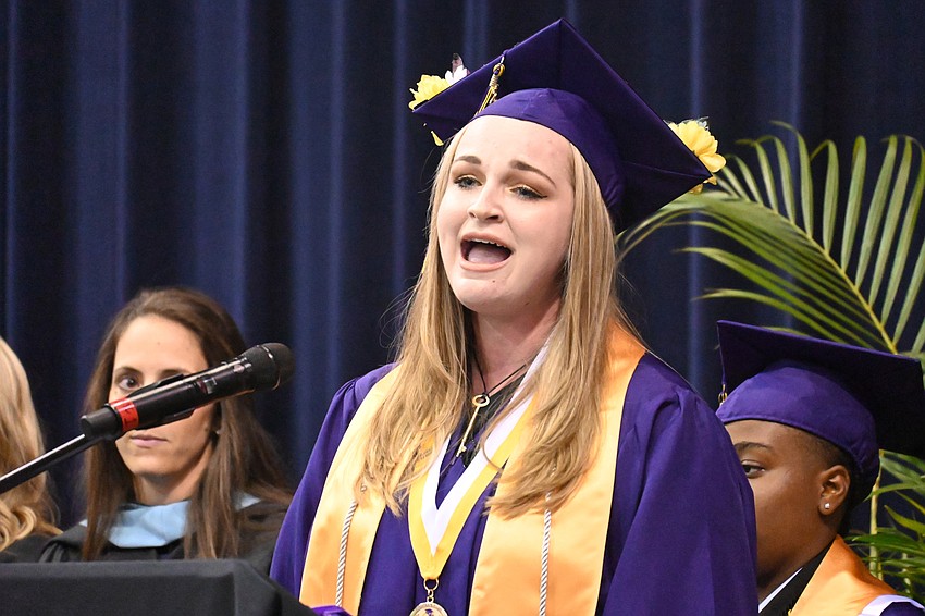Graduate Abigail Holdway sang the National Anthem