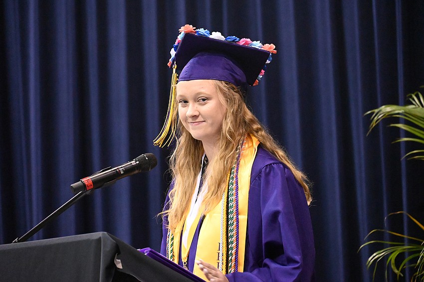 Graduate Jenna Logan introduced the distinguished guests