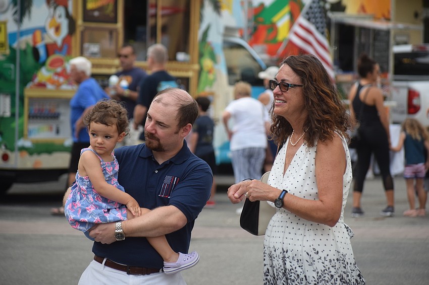 Lakewood Ranch 2-year-old Erin Viaud checks out the Lakewood Ranch Wind Ensemble with her dad, Jonathan Viaud, and her grandmother, Sarah Montemarano.