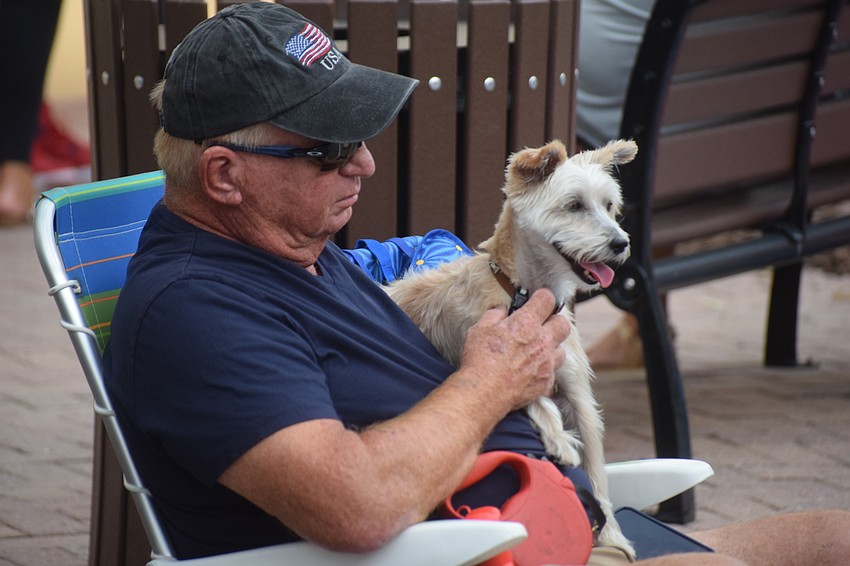 Lakewood Ranch's Ernie Swanson found a good spot along the street for his dog Scruffy to watch the parade.