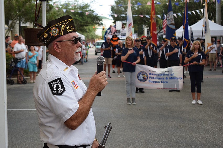 Dave Daily, the grand marshal of the 2019 Tribute to Heroes Parade, leads the crowd in the Pledge of Allegiance.  Daily represents VFW Post 12055.