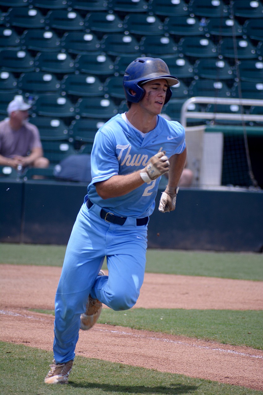 ODA senior Aidan Marino sprints to beat out a throw to first base.