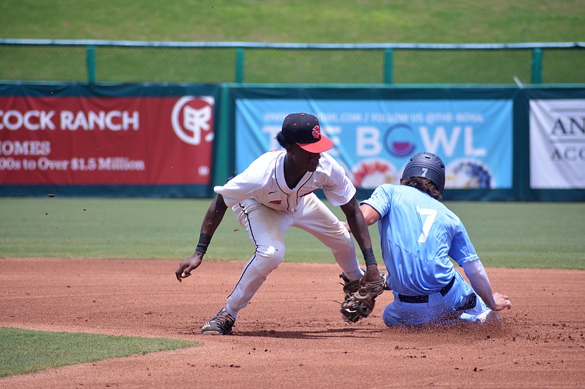 ODA junior Giovanni Giuliani safely slides into second base against North Florida Christian.
