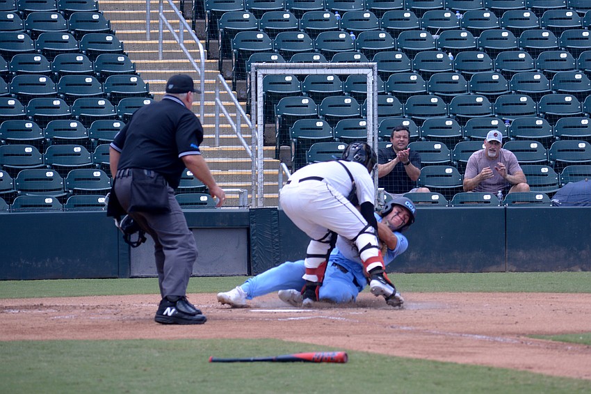 ODA junior Giovanni Giuliani is thrown out at home plate by North Florida Christian in the first inning.