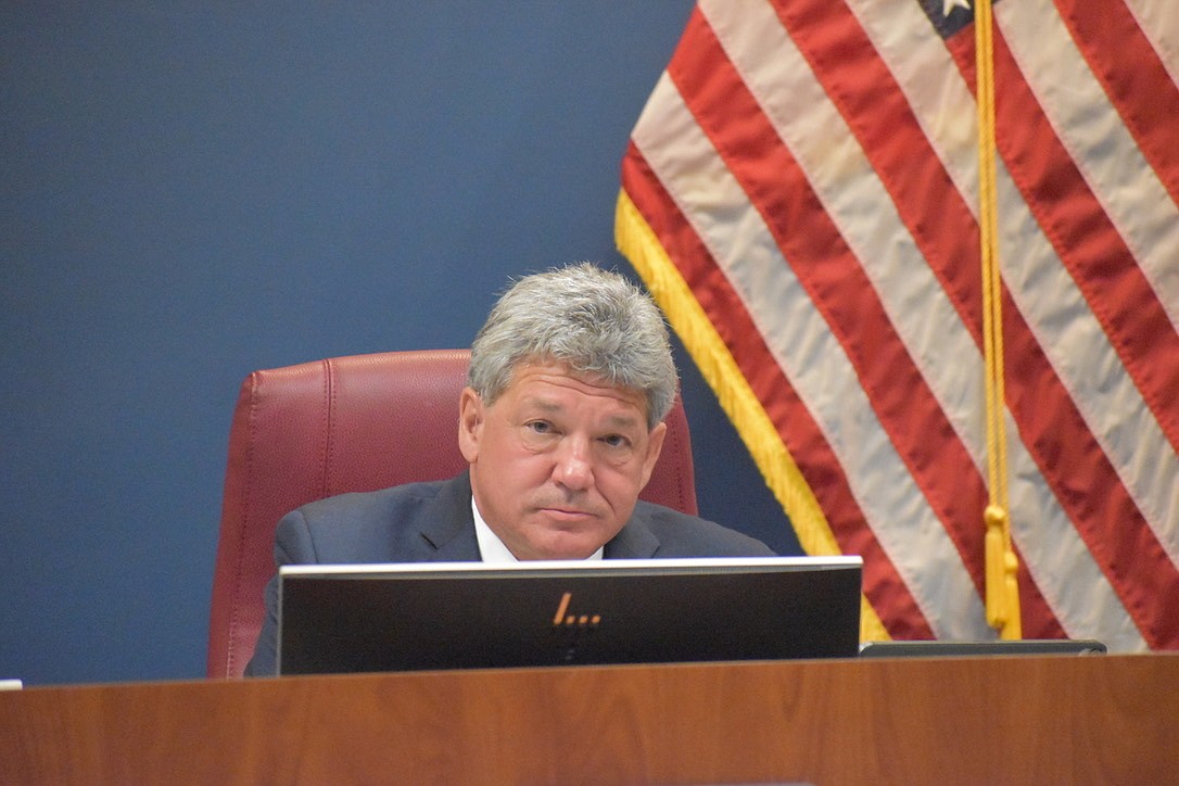 After a vigorous debate, the commissioners decided to extend the contract of County Administrator Scott Hopes to 2023.