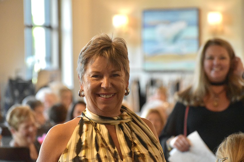 River Strand's Ellen Hunt dazzles with a striped outfit as she walks the runway.