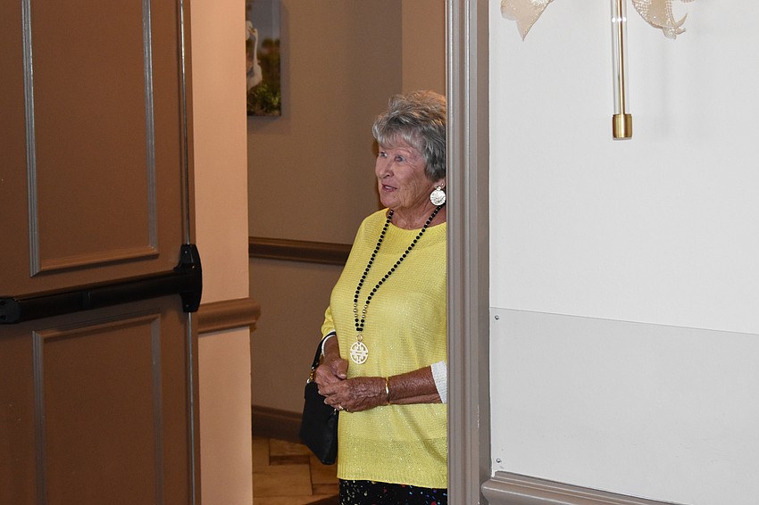 River Strand's Nancy Morgans waits her turn to walk the runway.