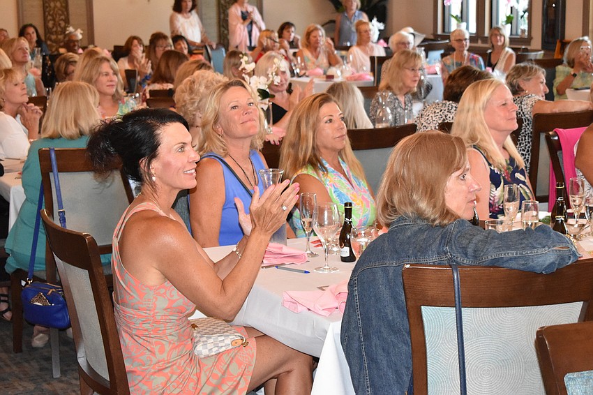 The crowd loves the outfits as well as the fact they are helping the food bank.