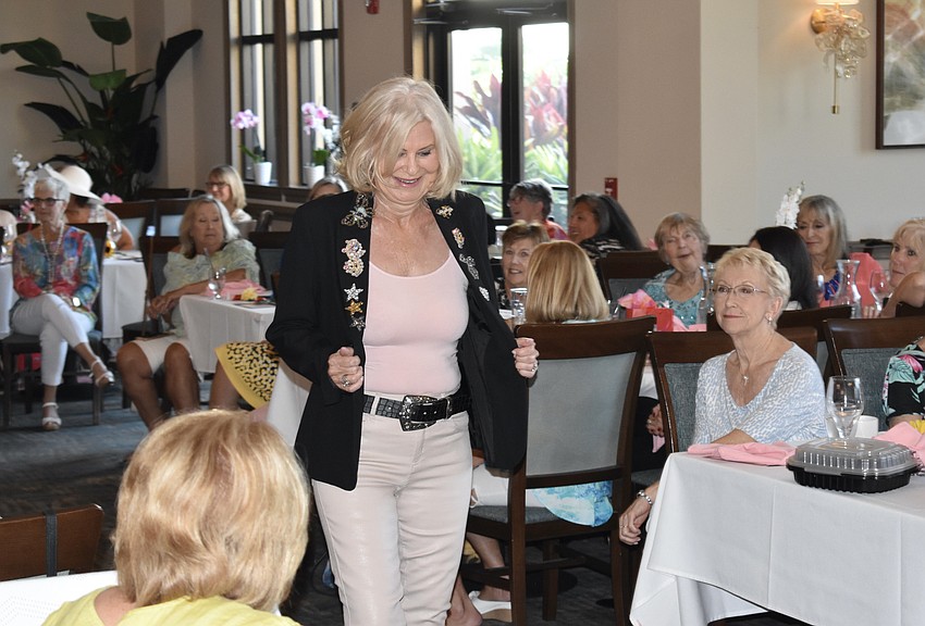 All eyes are on Joan Clowser as she walks the runway.