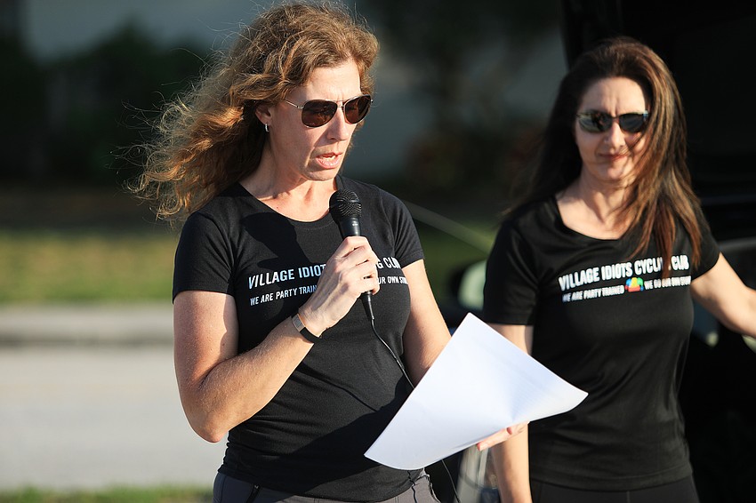 Village Idiots president Dawn Zielinski welcomes riders and begins the program.