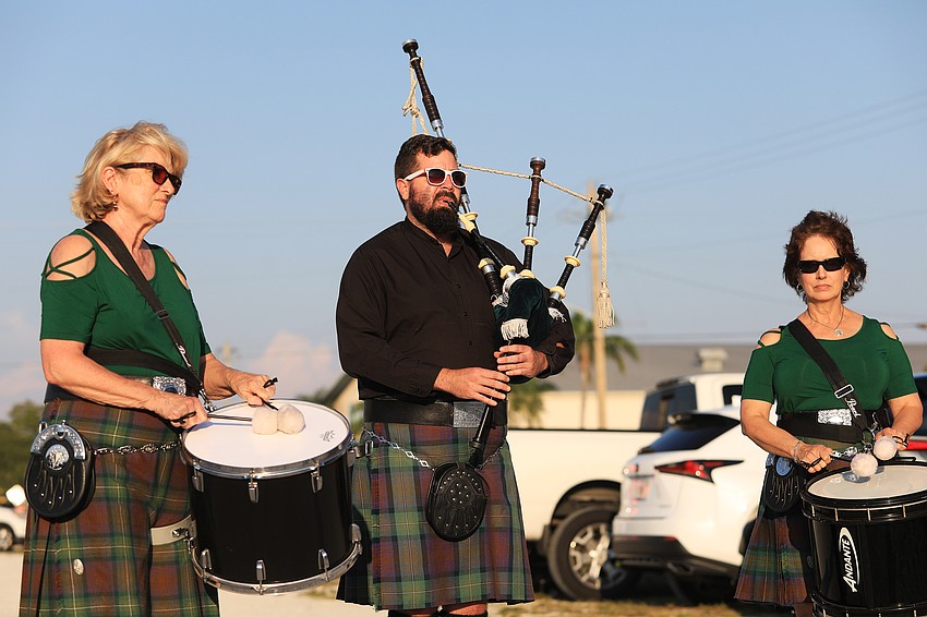 Deborah Houston, Micah Adams and Mary Hutchinson play music to start the ride.