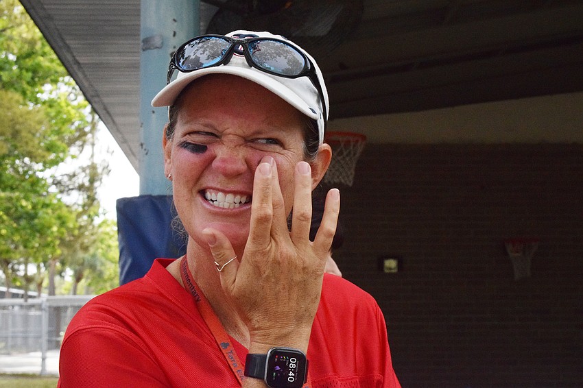 Amy Teta, a physical education teacher, puts on 