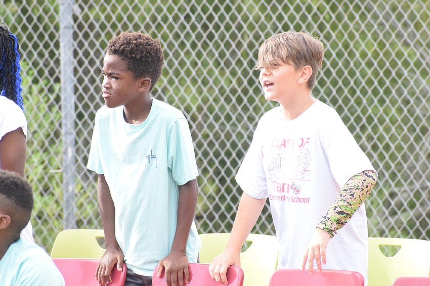 Fifth graders Noah Siffermann and Nathan Dolan chant 