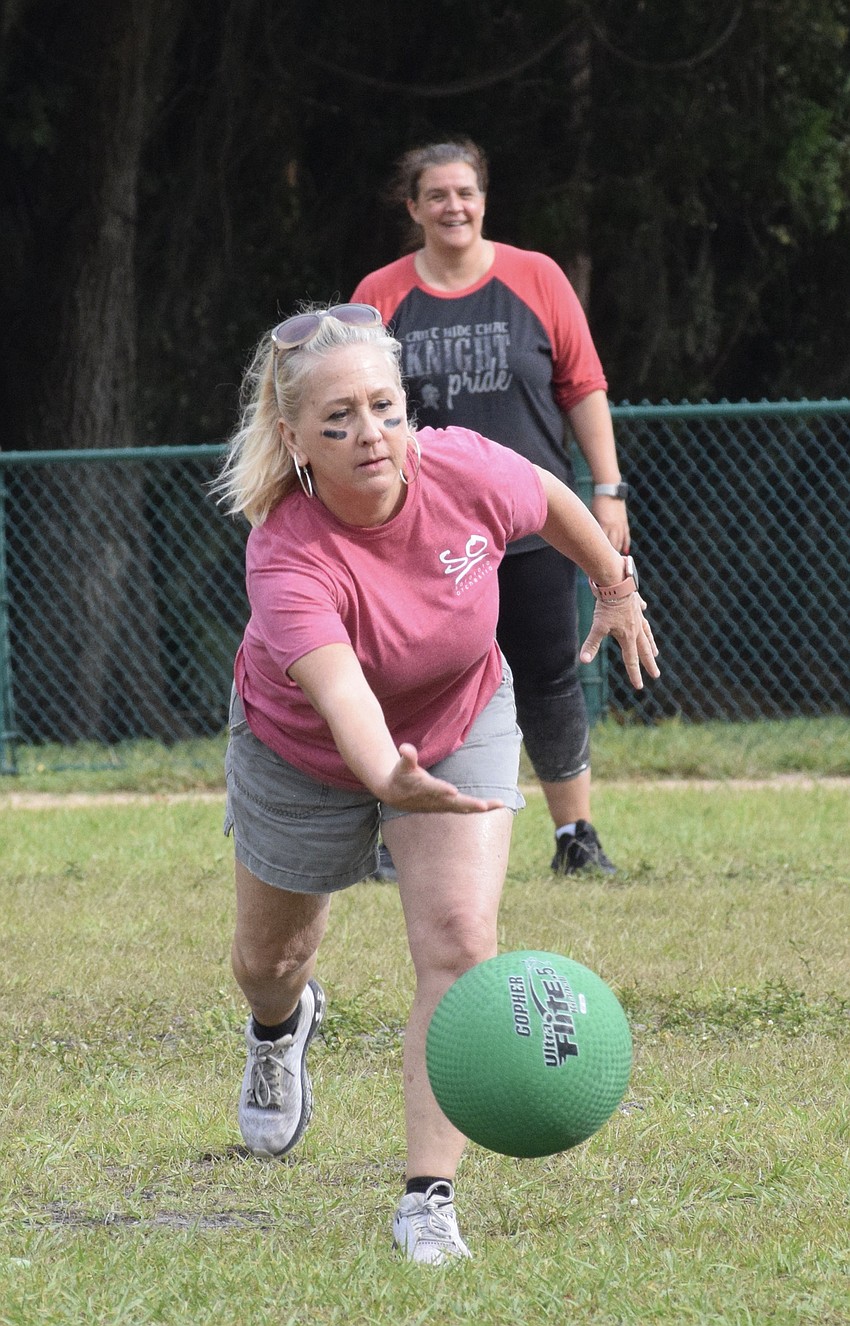 Music teacher Barbara Siffermann becomes pitcher so she can pitch to her son Austin Siffermann, who is a fifth grader. Before pitching the ball, she blew him a kiss.