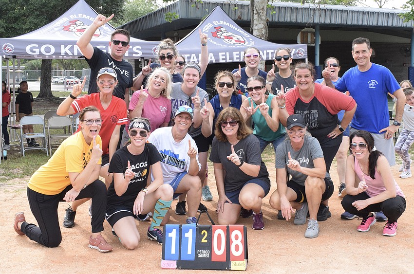 Teachers and staff celebrate their victory over the fifth grade class.