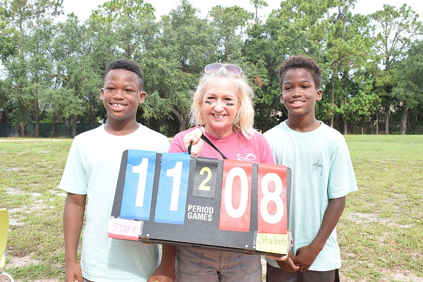 Fifth graders Austin and Noah Siffermann are disappointed to lose against their mom, Barbara Siffermann, who is the music teacher, and other teachers and staff. Barbara Siffermann says playing against her boys was bittersweet.