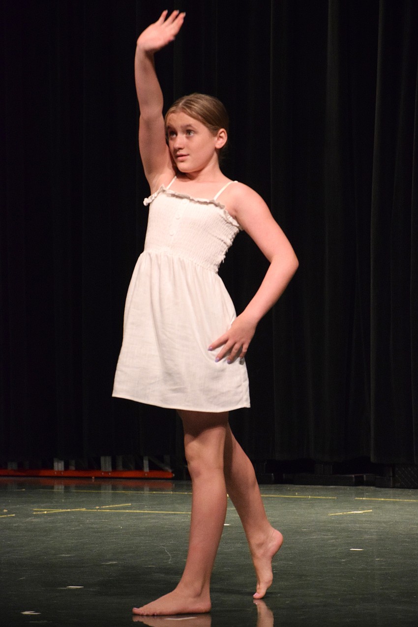 Fifth grader Avery Ruffing dances to Hannah Montana's 